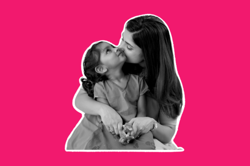An image of a mum with her child, hugging with a bright pink background